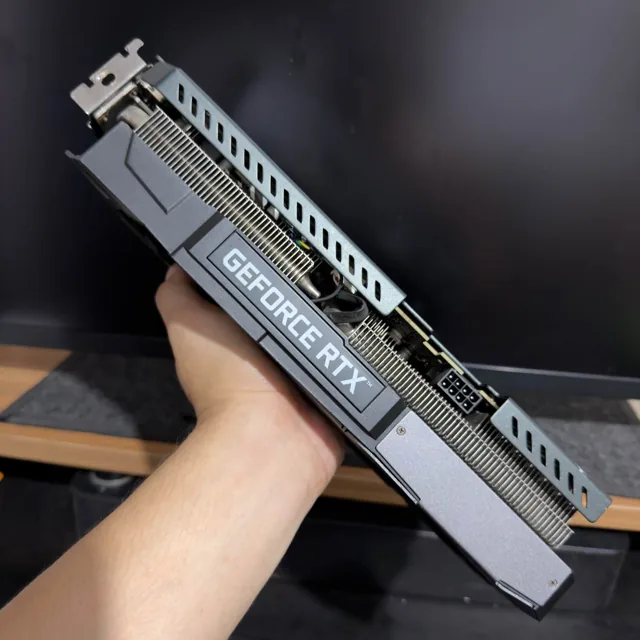 White GeForce RTX graphics card, side profile